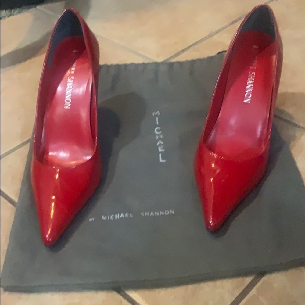Red patent leather 3 1/2” heels with dust bag.